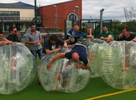 Groom and his stag buddies playing bubble match in Berlin